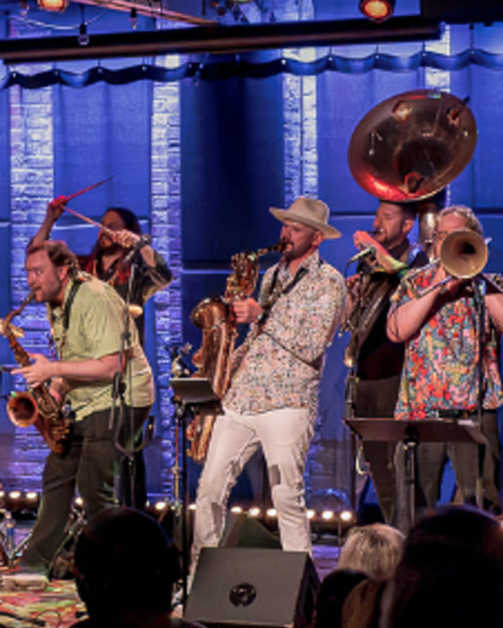 Big Shoulders Brass Band performing on stage.